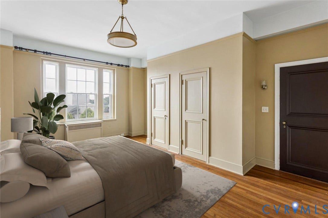 612 W Franklin Street, #5E, Richmond, VA 23220 Hardwood flooring, multi-pane windows, ceiling-mounted light fixture, wall sconce, and paneled doors