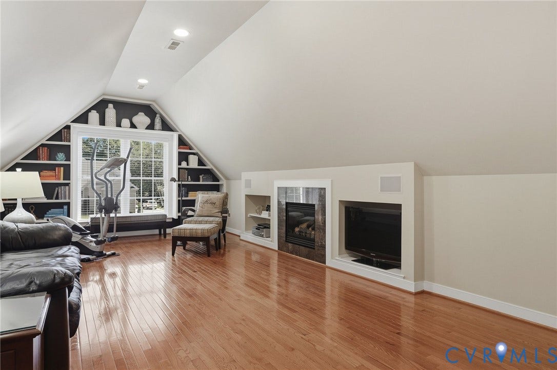 3012 Hedgeway Place, Tarrington, Midlothian, VA 23113 Hardwood flooring, recessed lighting, built-in shelving, integrated fireplace, and a large window