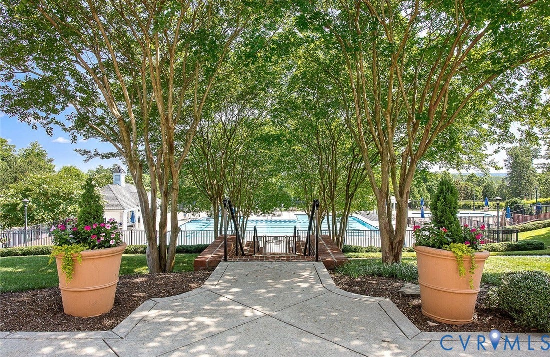 3012 Hedgeway Place, Tarrington, Midlothian, VA 23113 Concrete pathway leading to a fenced pool area with a building