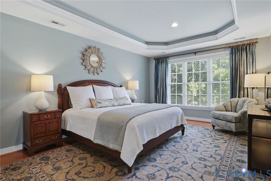 3012 Hedgeway Place, Tarrington, Midlothian, VA 23113 Tray ceiling with recessed lighting, large window with plantation blinds, wood-finish flooring, and a substantial wood bed frame