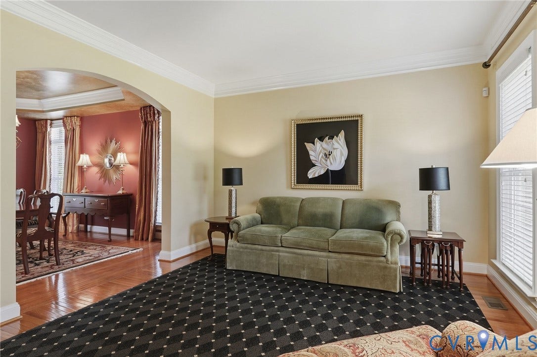 3012 Hedgeway Place, Tarrington, Midlothian, VA 23113 Crown molding details, arched entry, hardwood flooring, and neutral wall tones