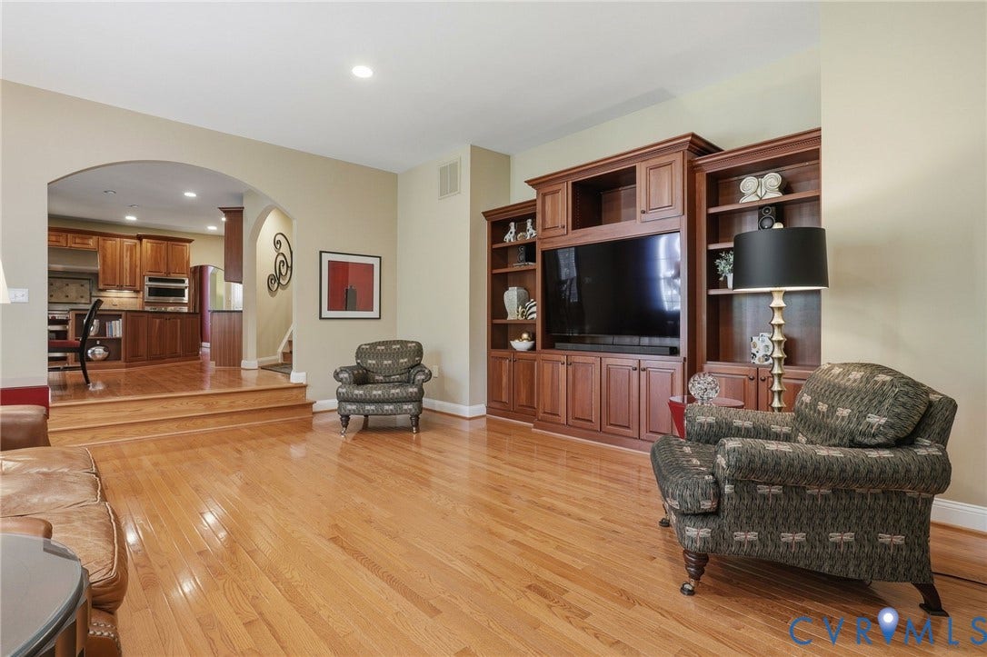 3012 Hedgeway Place, Tarrington, Midlothian, VA 23113 Hardwood flooring throughout, built-in entertainment center, recessed lighting, and arched doorway