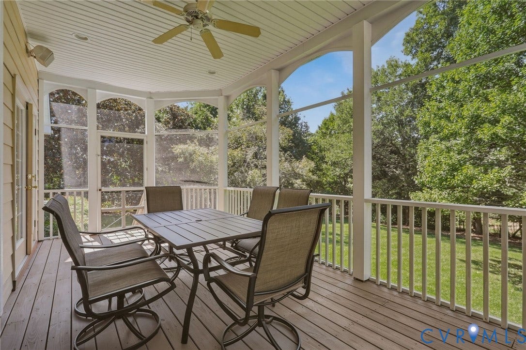 3012 Hedgeway Place, Tarrington, Midlothian, VA 23113 Expansive screened porch with a wood-finish deck, ceiling fan, and white railing overlooking a grassy area with mature trees
