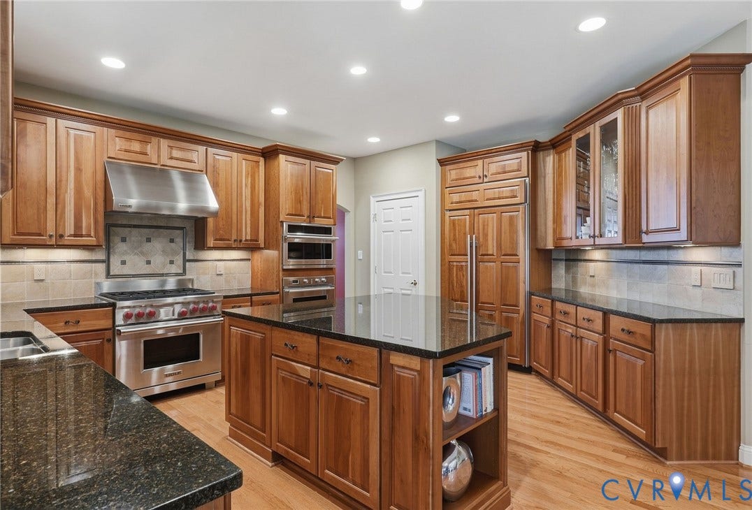 3012 Hedgeway Place, Tarrington, Midlothian, VA 23113 Wood-finish cabinetry with crown molding, stainless steel appliances, dark stone countertops, tile backsplash, and recessed lighting