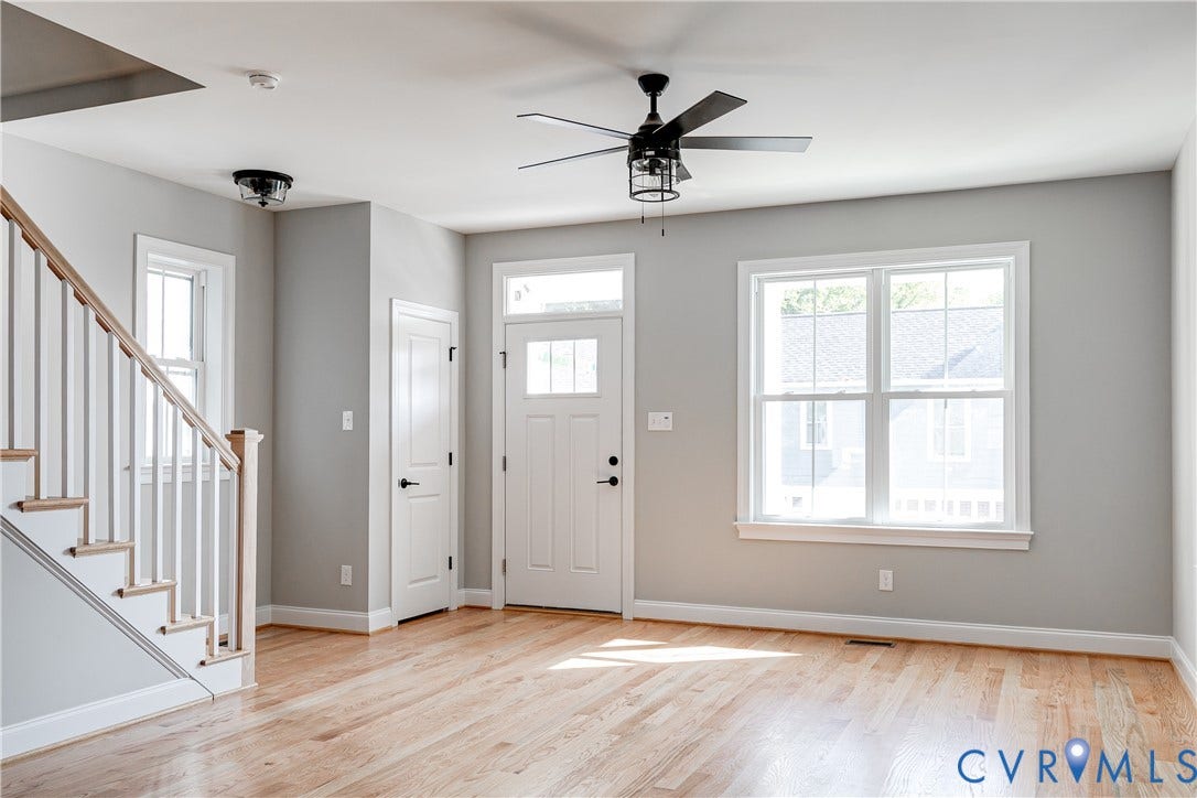 Hardwood flooring, painted walls, white trim, recessed lighting, and a ceiling fan