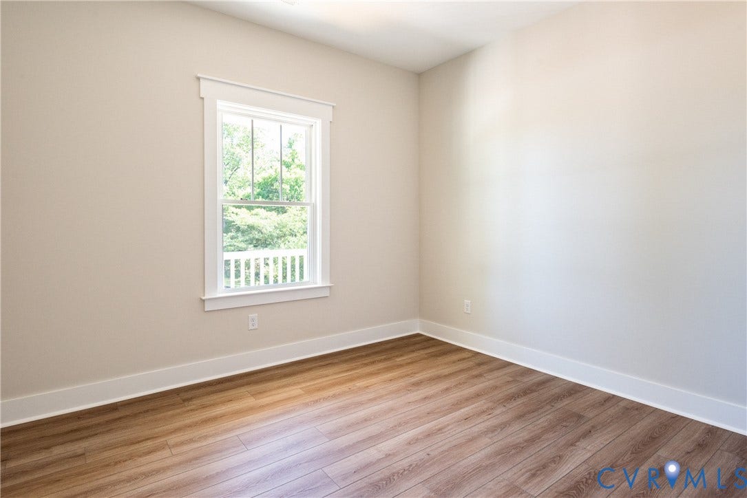 1343 Stokes Station Road, Goochland, VA 23063 neutral wall tones, white trim, and a window with exterior railing