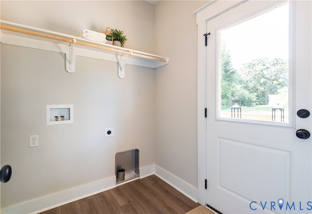 1343 Stokes Station Road, Goochland, VA 23063 Dedicated laundry space featuring a half-lite exterior door, and built-in shelving with a hanging rod