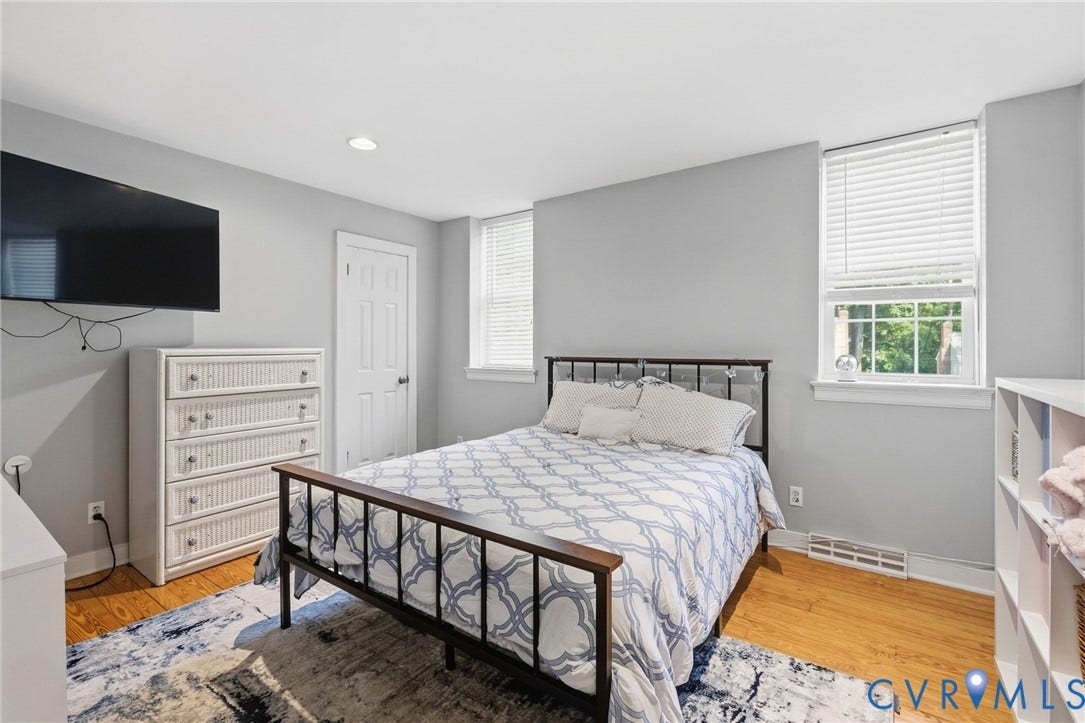 10407 Silverbrook Drive, Henrico, VA 23233 Recessed lighting, wood-finish flooring, two windows with blinds, and built-in shelving