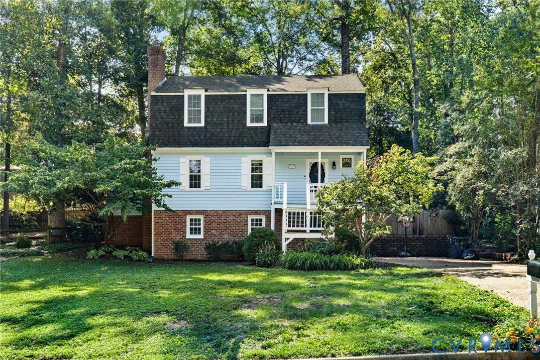 10407 Silverbrook Drive, Henrico, VA 23233 Two-story residence with light blue siding and brick accents