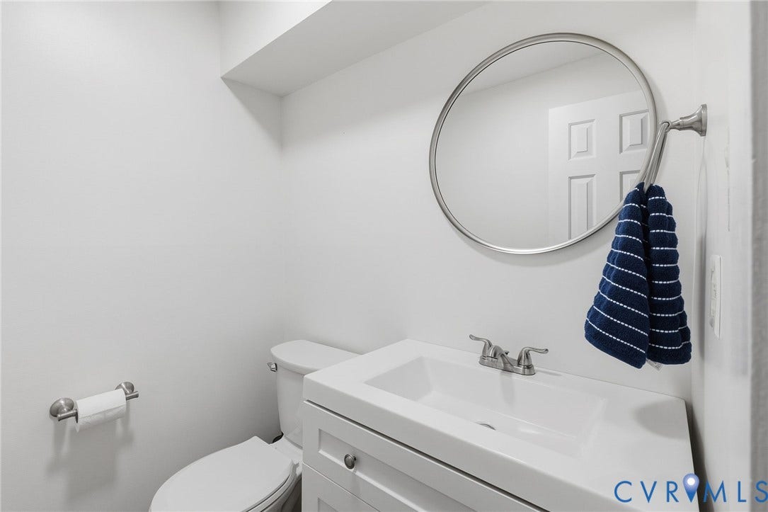 10407 Silverbrook Drive, Henrico, VA 23233 White vanity with an integrated rectangular sink and brushed nickel hardware