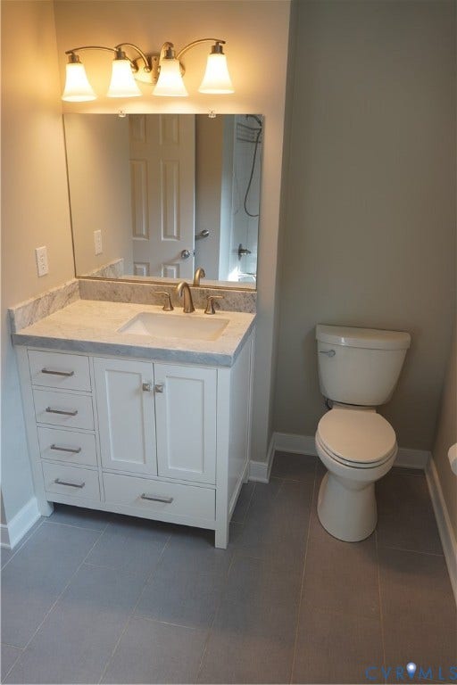 10227 Acworth Drive, Glen Allen, VA 23060 Hall bath has tile floor, great vanity with Carrara marble top and Americast tub and beautiful tile surround