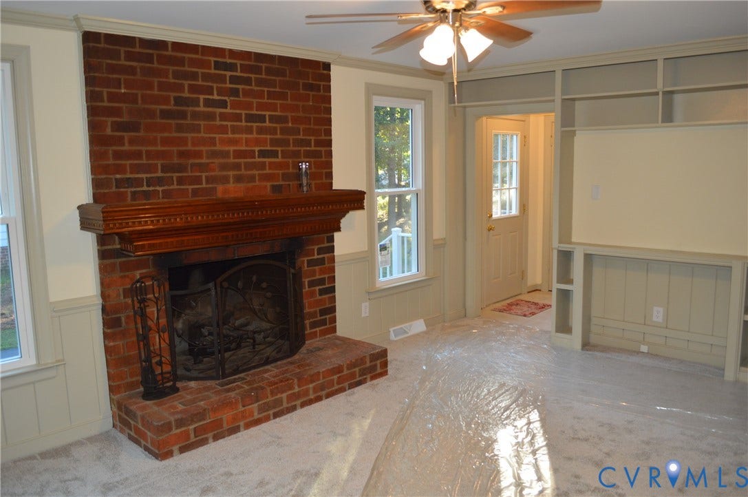 10227 Acworth Drive, Glen Allen, VA 23060 Brick fireplace with a detailed wood mantel