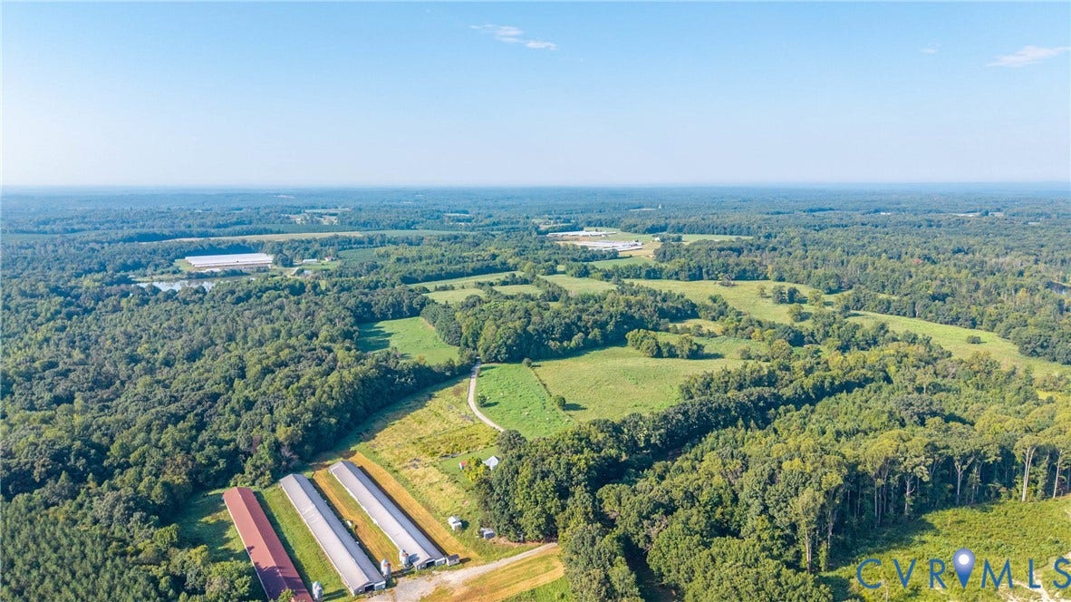 78 Bowling Lane, Cumberland, VA 23040 Expansive land parcel featuring multiple outbuildings, wooded areas, and open fields