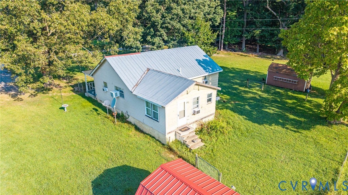 78 Bowling Lane, Cumberland, VA 23040 Expansive green grounds with mature trees and a detached shed