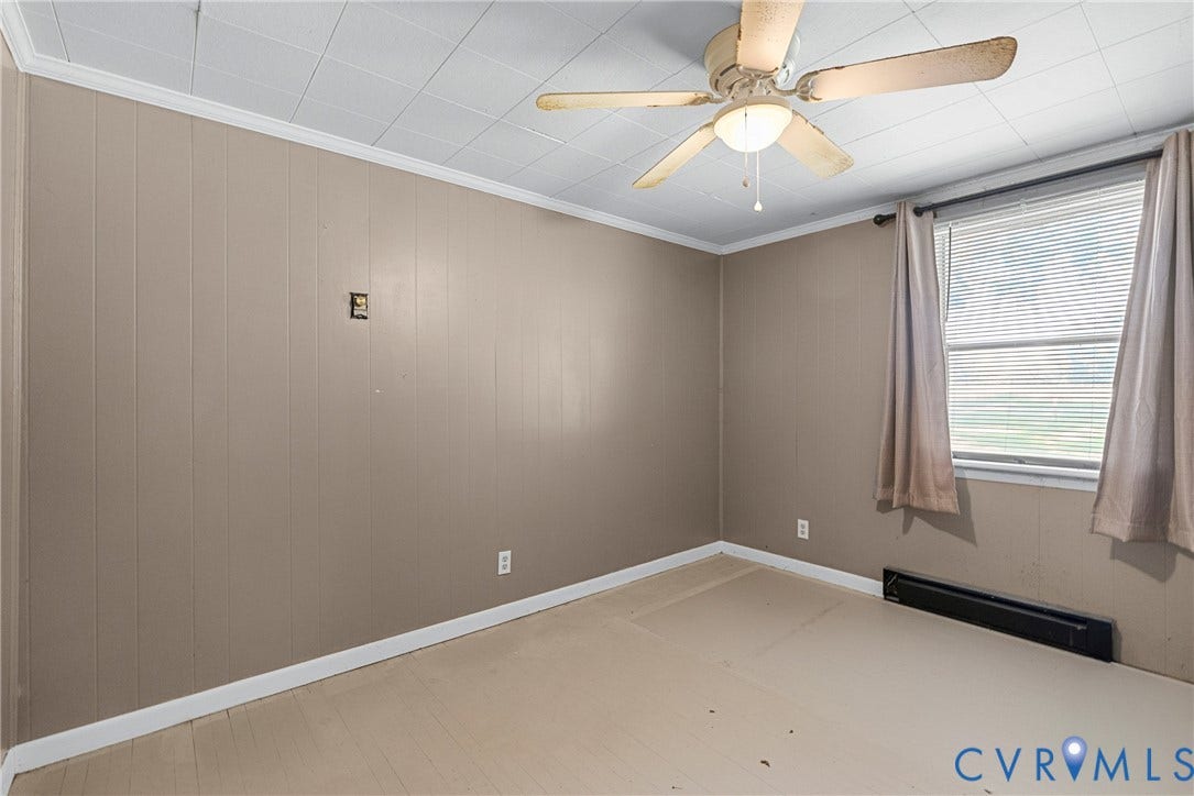 78 Bowling Lane, Cumberland, VA 23040 Textured paneling walls and ceiling fan with integrated lighting