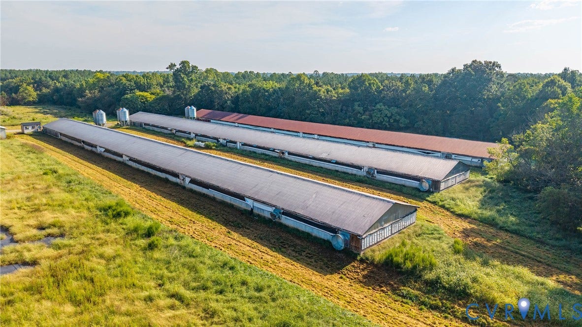 78 Bowling Lane, Cumberland, VA 23040 Multiple long agricultural structures, two featuring gray roofs, two with red roofs