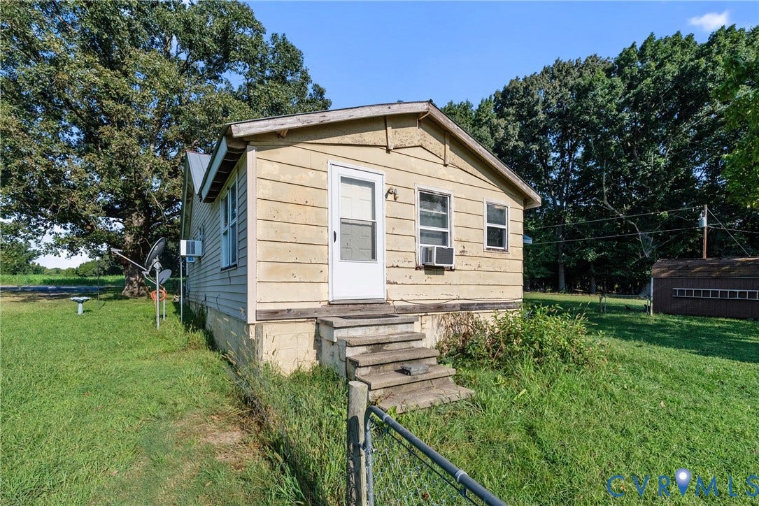 78 Bowling Lane, Cumberland, VA 23040 Single-story residence with a light-colored siding exterior, a front entry door, and multiple windows