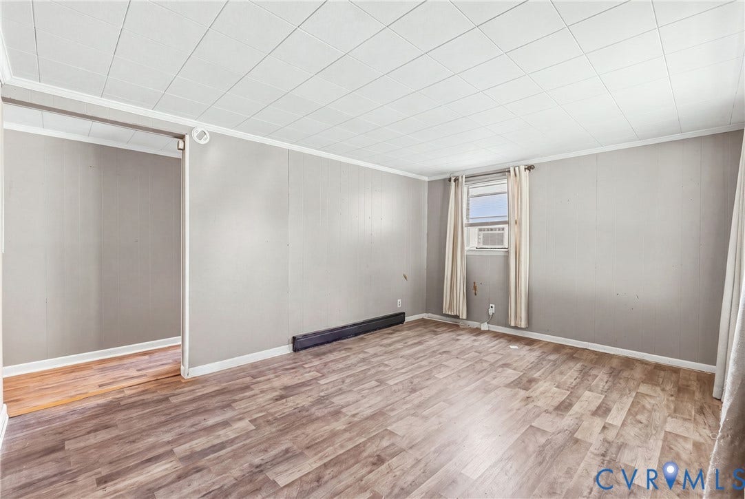 78 Bowling Lane, Cumberland, VA 23040 Wood-finish flooring with light-toned wall panels, white trim, and a white ceiling