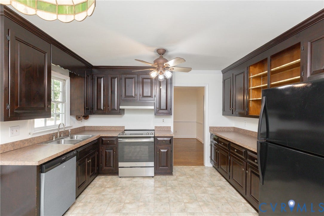 2765 Briarpatch Lane, Powhatan, VA 23139 Kitchen featuring dark wood cabinetry, light-toned countertops, stainless steel range, and ceiling fan