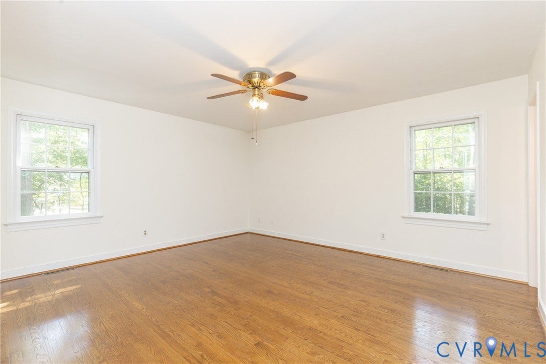 2765 Briarpatch Lane, Powhatan, VA 23139 Hardwood flooring, painted walls, two windows, and a ceiling fan with integrated lighting