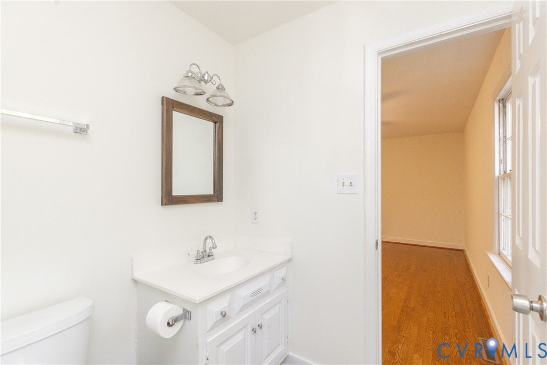 2765 Briarpatch Lane, Powhatan, VA 23139 Bathroom vanity with a white countertop, chrome faucet, and framed mirror