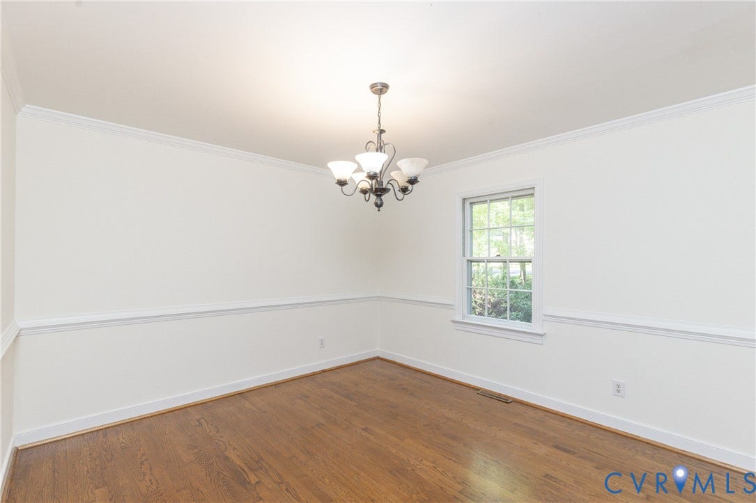 2765 Briarpatch Lane, Powhatan, VA 23139 Hardwood flooring, classic chandelier, crown molding, chair rail, and single pane window