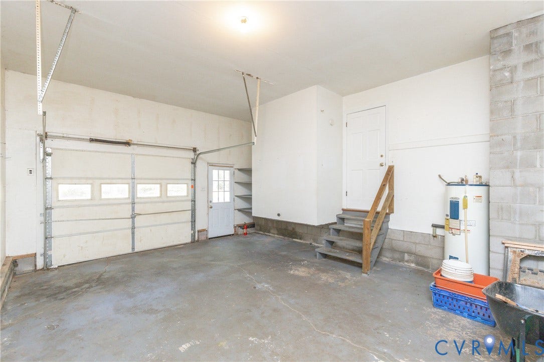 2765 Briarpatch Lane, Powhatan, VA 23139 Single-vehicle garage with an overhead door featuring frosted window panels