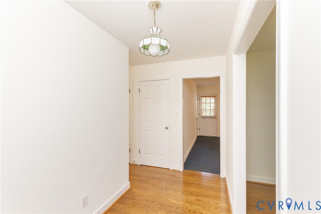 2765 Briarpatch Lane, Powhatan, VA 23139 Hardwood flooring, painted interior doors, and a decorative ceiling light fixture