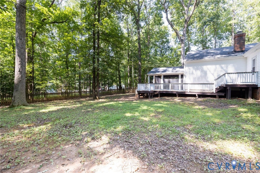 2765 Briarpatch Lane, Powhatan, VA 23139 Expansive backyard featuring a multi-level deck, a screened porch, and a wood privacy fence