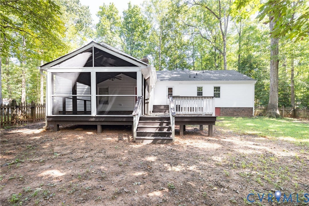 2765 Briarpatch Lane, Powhatan, VA 23139 Rear exterior with white siding, screened porch, and elevated wood deck