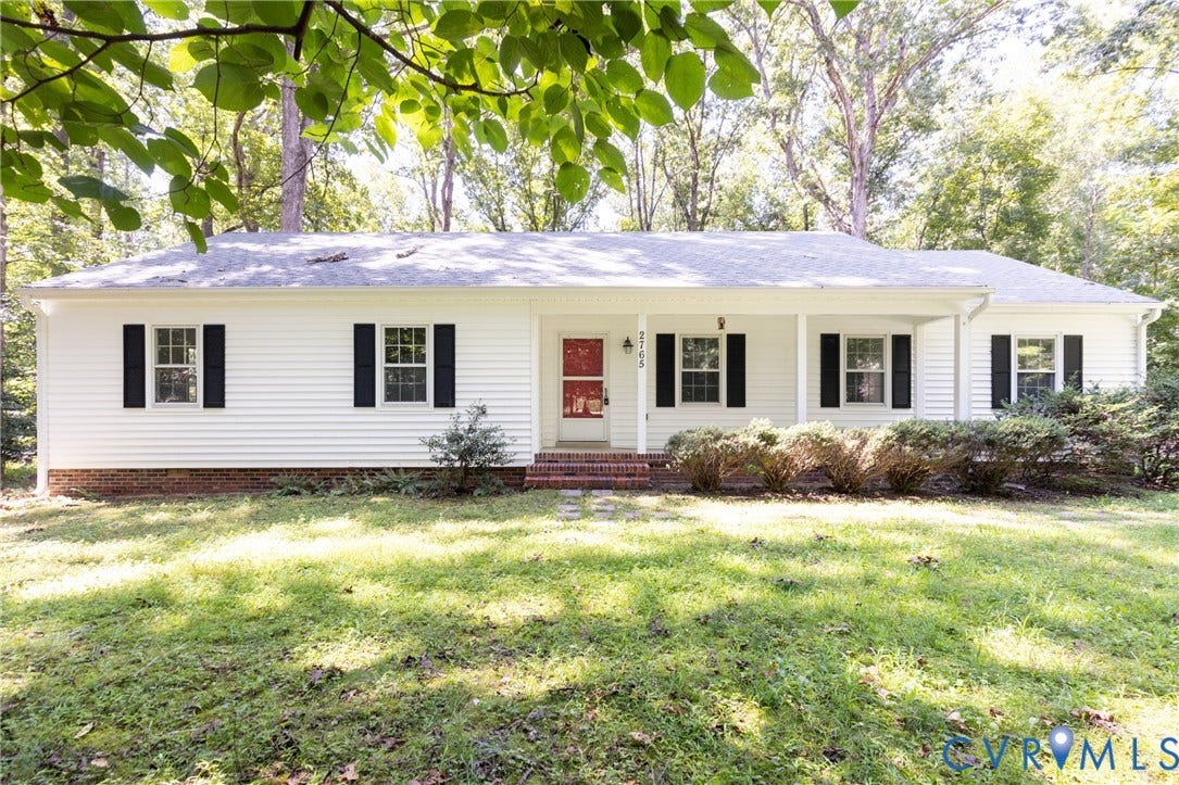 2765 Briarpatch Lane, Powhatan, VA 23139 White siding exterior with black shutters, covered front porch, brick foundation, and mature landscaping