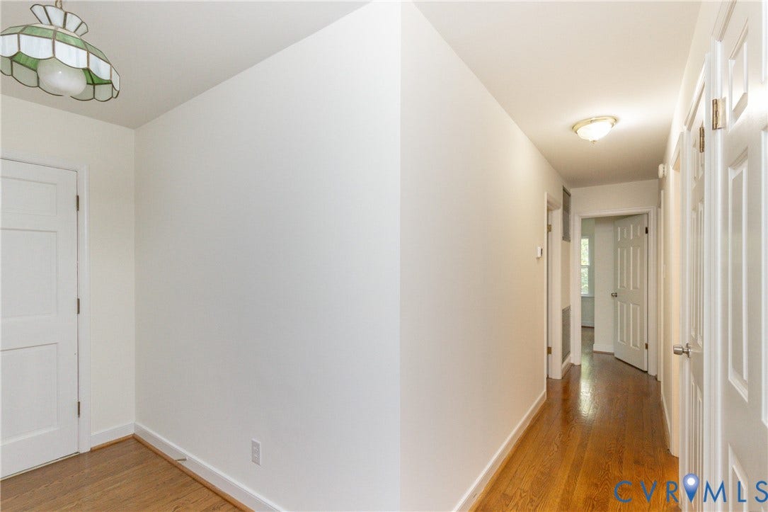 2765 Briarpatch Lane, Powhatan, VA 23139 Hardwood-finish flooring, white paneled doors, ceiling-mounted lighting fixtures, and light neutral wall colors