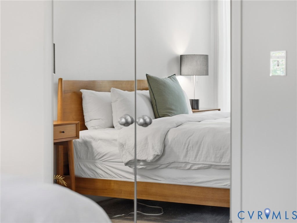 Mirrored closet doors providing a bright aesthetic