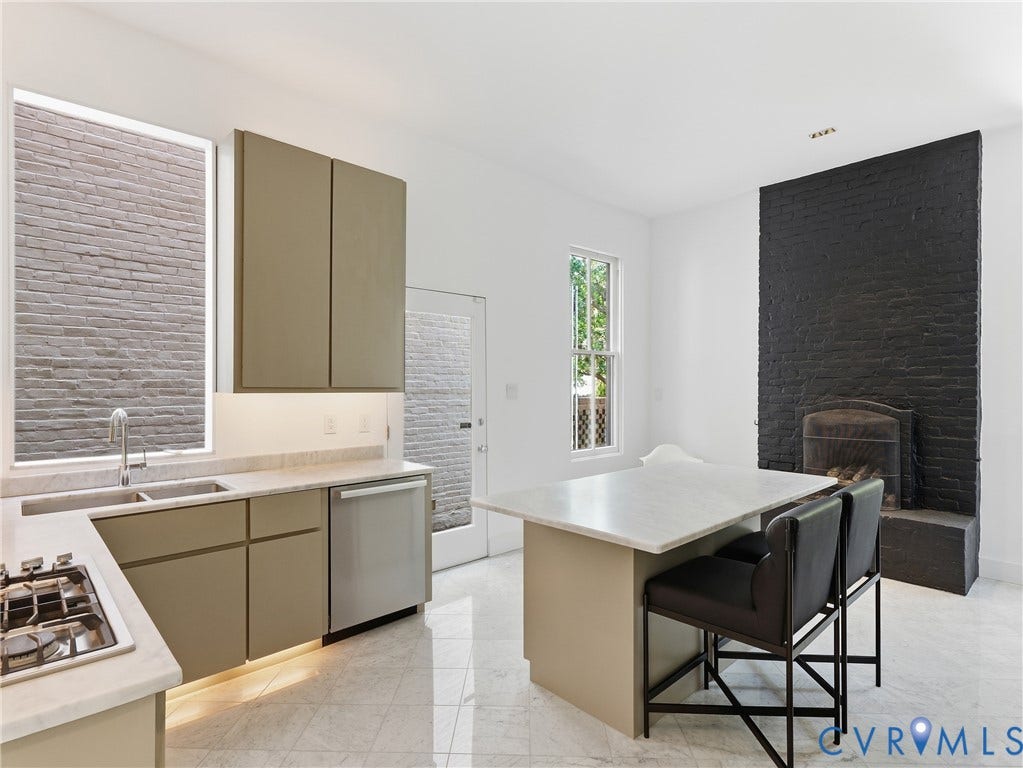 Kitchen featuring an integrated gas cooktop, double basin sink, stainless steel dishwasher, and under-cabinet lighting