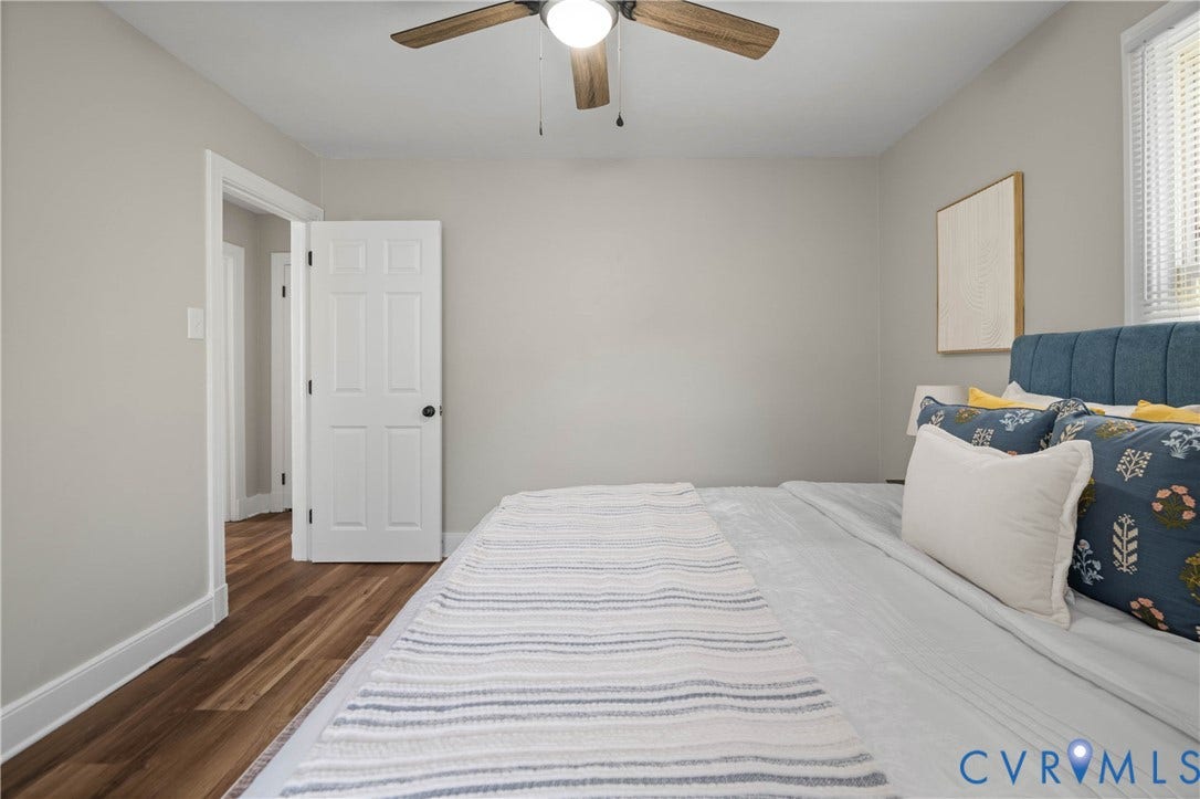 5429 Parker Street, Fulton Hill, Richmond, VA 23231 Hardwood-style flooring throughout, ceiling fan with integrated lighting, window with blinds, and a paneled door