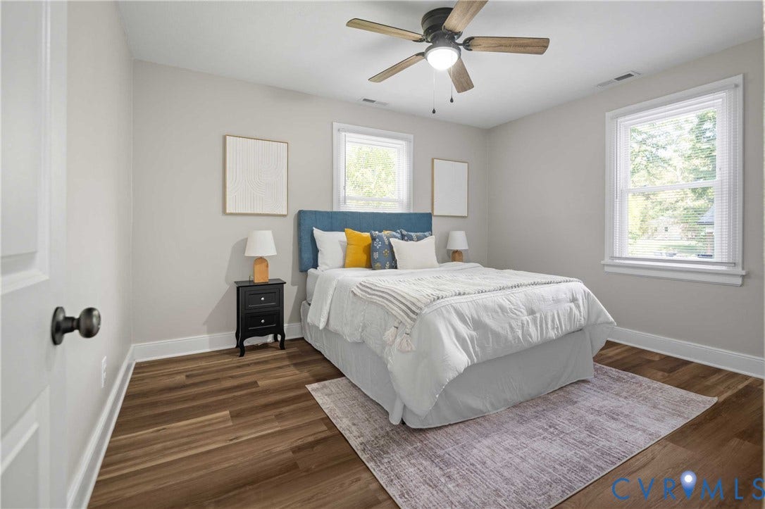 5429 Parker Street, Fulton Hill, Richmond, VA 23231 Wood-finish flooring, white trim, and light gray wall paint