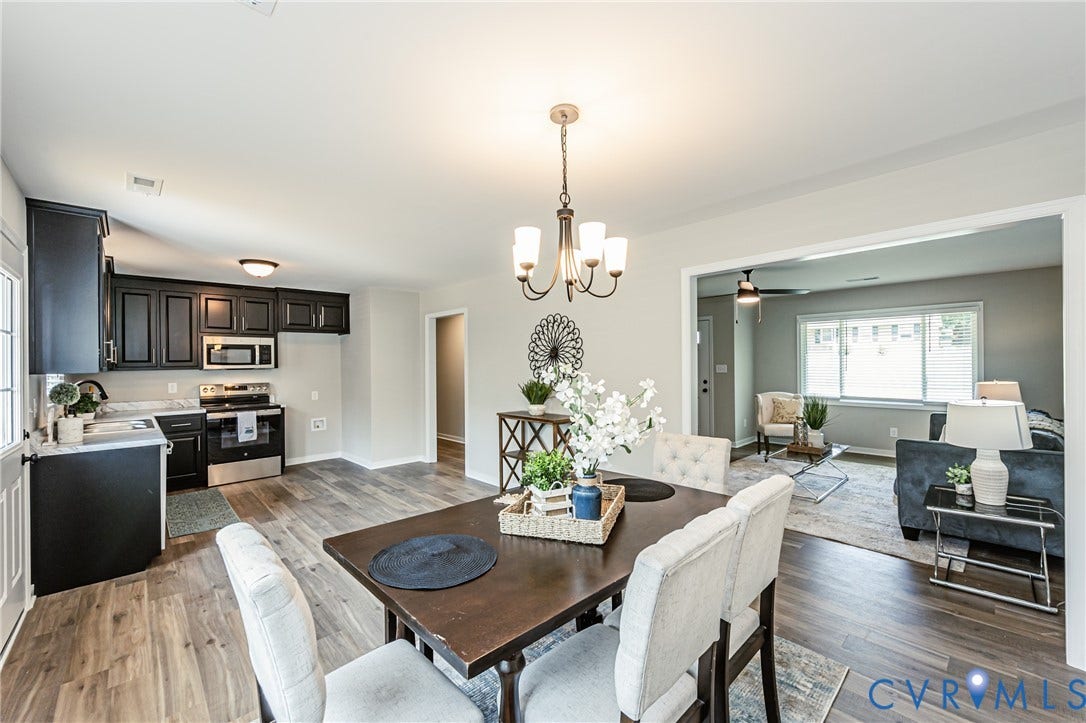 2702 Manchester Drive, New Birchett Estates, Prince George, VA 23875 Wood-finish flooring throughout, with a dining area featuring a chandelier