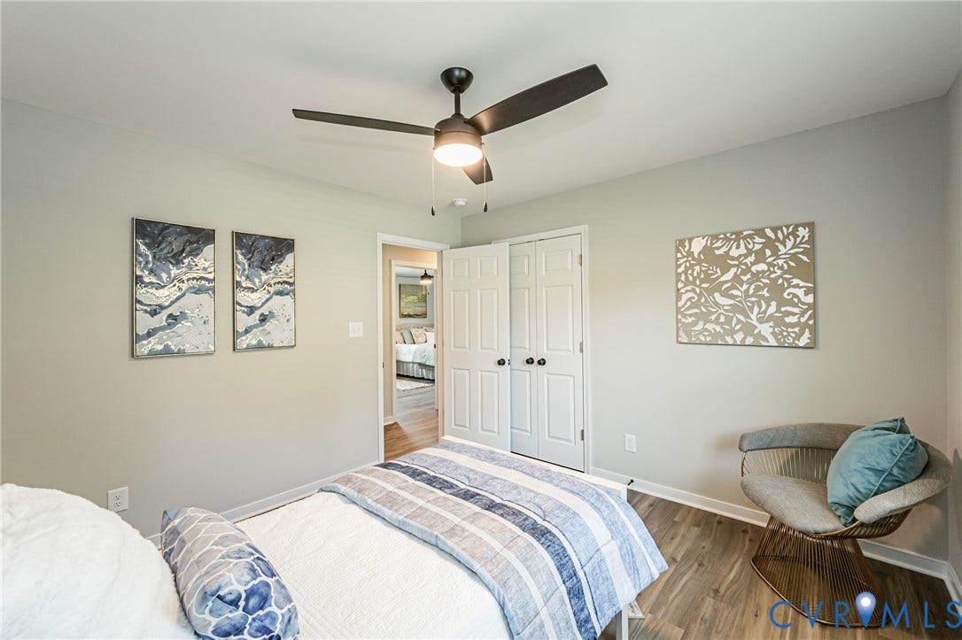 2702 Manchester Drive, New Birchett Estates, Prince George, VA 23875 Wood-finish flooring, ceiling fan, and white bi-fold closet doors