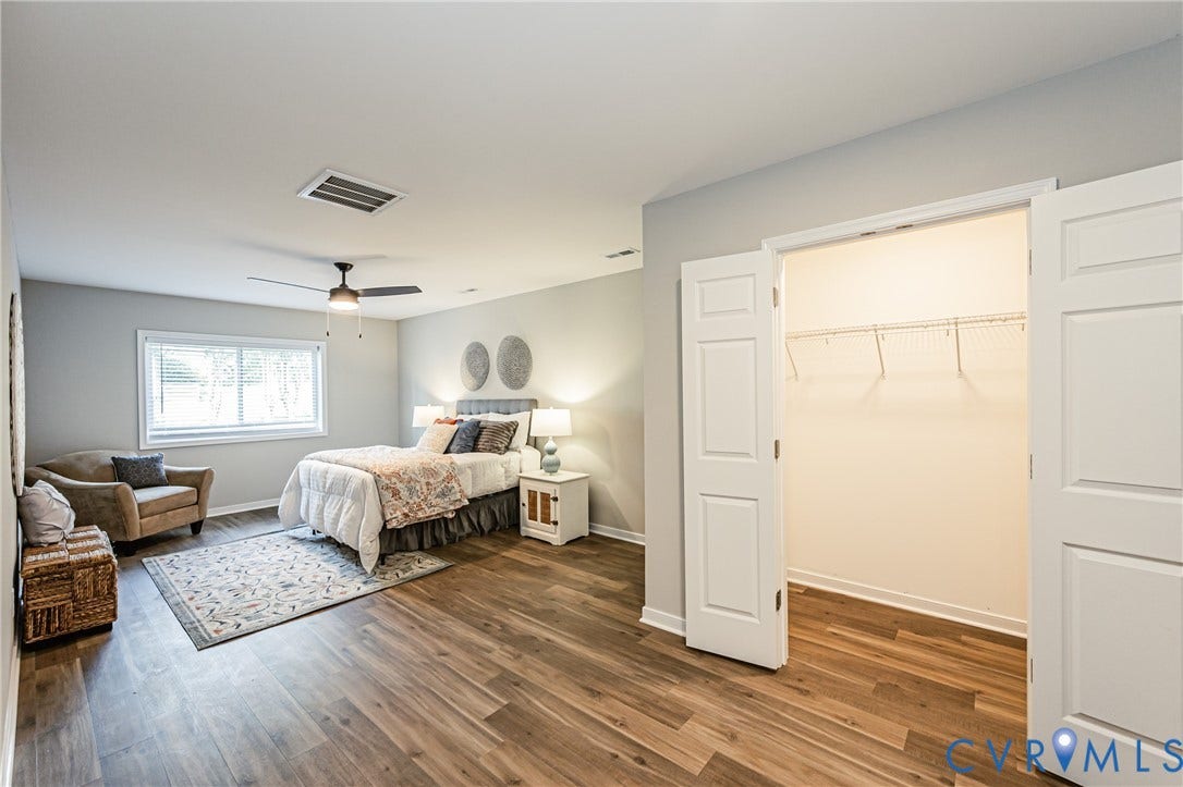 2702 Manchester Drive, New Birchett Estates, Prince George, VA 23875 Wood-finish flooring, ceiling fan, double-pane window, and bifold closet doors with wire shelving