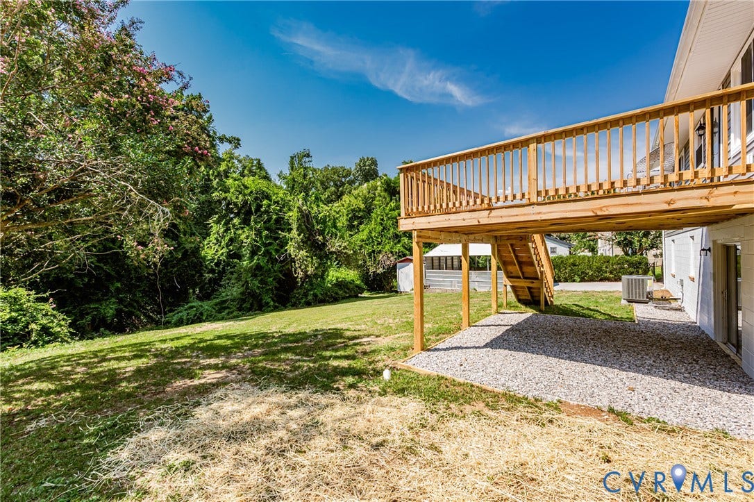 2702 Manchester Drive, New Birchett Estates, Prince George, VA 23875 Wood deck with baluster railing, external staircase, and gravel patio below