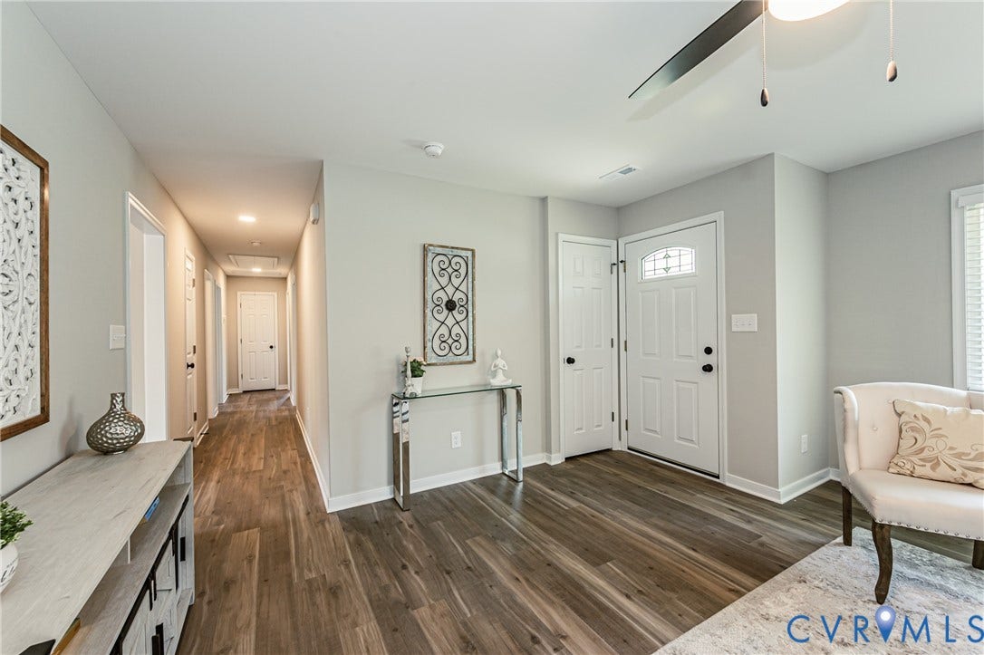 2702 Manchester Drive, New Birchett Estates, Prince George, VA 23875 Wood-finish flooring throughout, white paneled doors, recessed lighting in the hallway, ceiling fan, and white trim