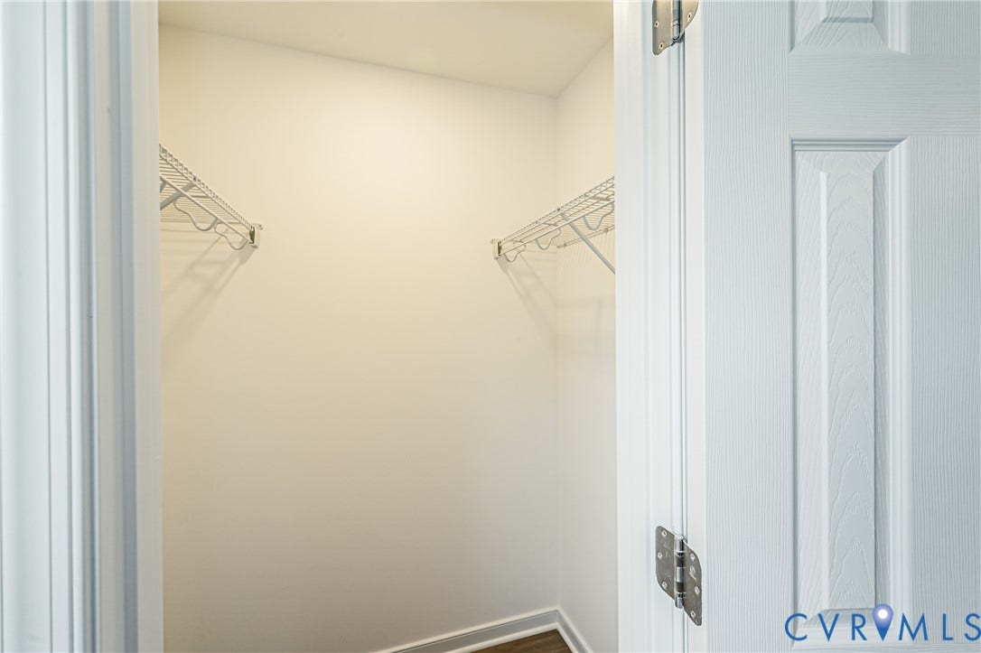 2702 Manchester Drive, New Birchett Estates, Prince George, VA 23875 Recessed closet with white wire shelving, light-toned wall paint, and wood-finish flooring