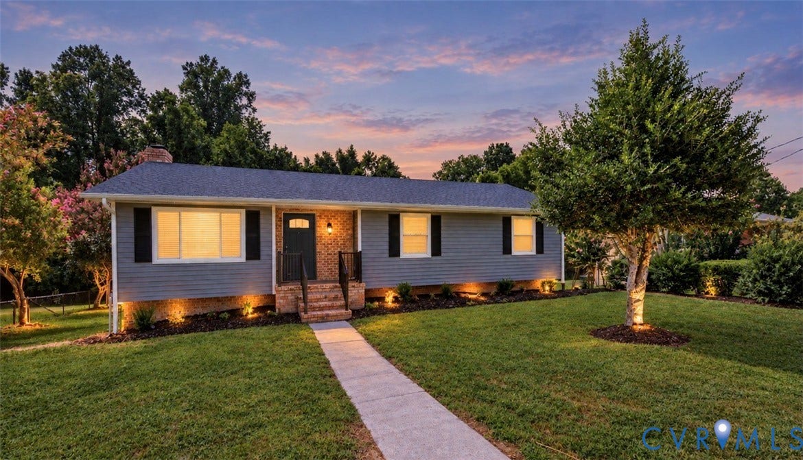2702 Manchester Drive, New Birchett Estates, Prince George, VA 23875 Gray siding exterior with dark shutters, brick entryway, and a concrete walkway