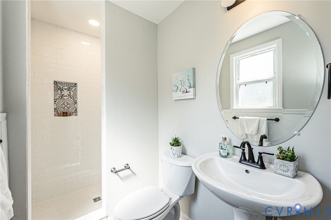 2702 Manchester Drive, New Birchett Estates, Prince George, VA 23875 Walk-in shower with subway tile surround and decorative tile niche