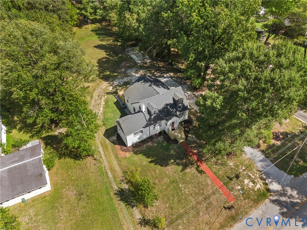 821 Fort Lee Road, North Dinwiddie, VA 23803 Exterior with white siding and gray roof, surrounded by mature trees