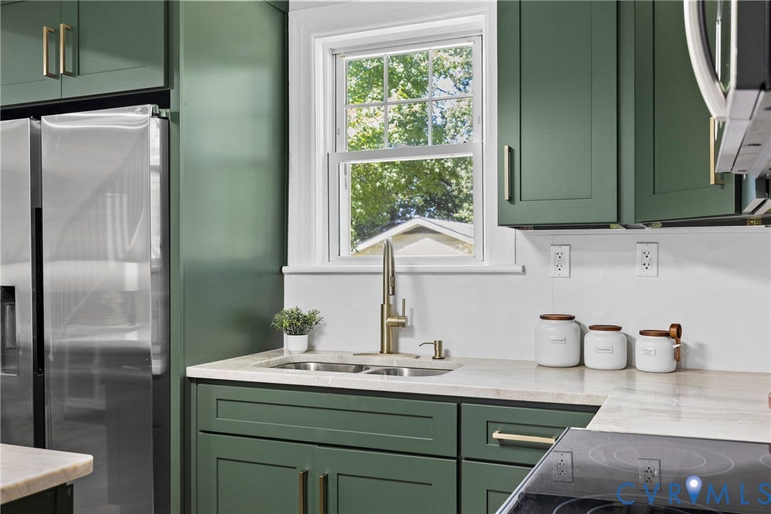 821 Fort Lee Road, North Dinwiddie, VA 23803 Kitchen featuring green shaker-style cabinetry, light-toned countertops, and a stainless steel refrigerator
