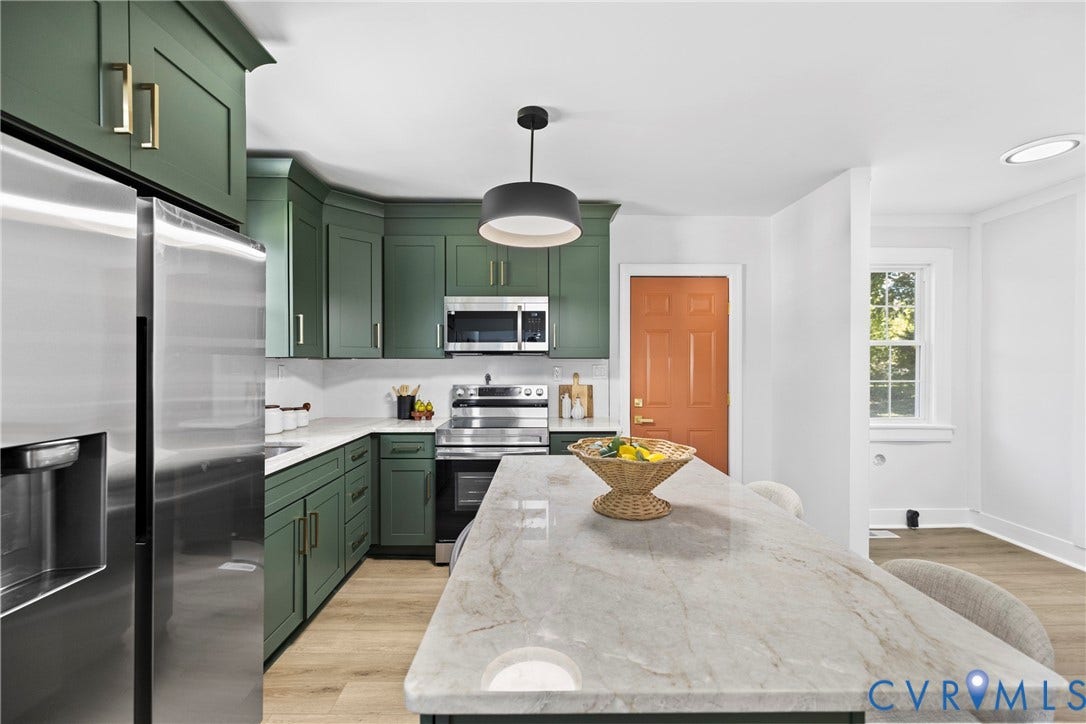 821 Fort Lee Road, North Dinwiddie, VA 23803 Kitchen featuring green cabinetry, stainless steel appliances, a white tile backsplash, a large island with a stone countertop, and wood-finish flooring