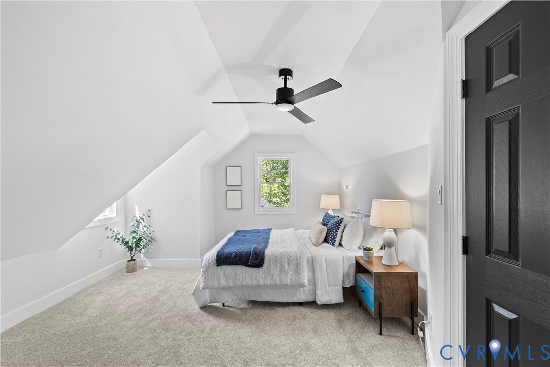 821 Fort Lee Road, North Dinwiddie, VA 23803 Vaulted ceilings, recessed window, dark paneled door, ceiling fan, and carpeted flooring
