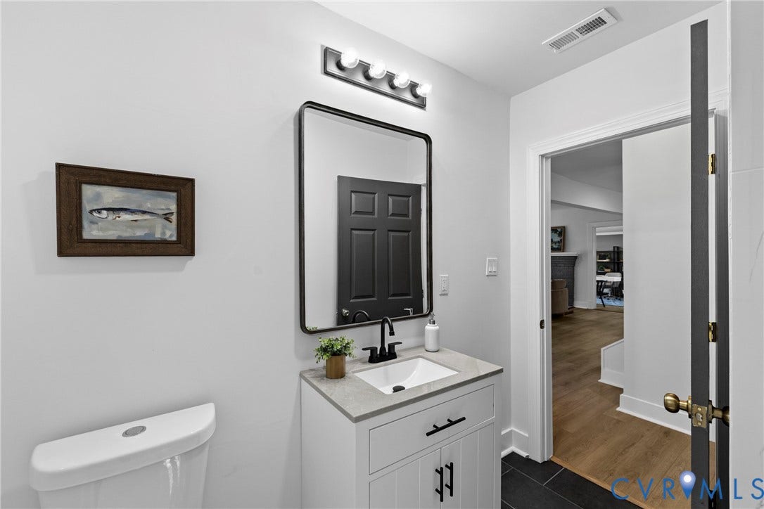 821 Fort Lee Road, North Dinwiddie, VA 23803 White vanity with a stone countertop, an integrated sink, and a matte black faucet