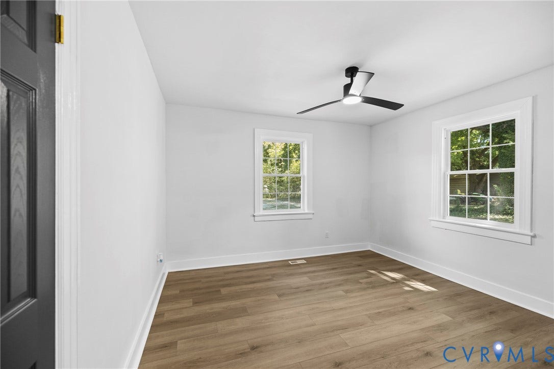 821 Fort Lee Road, North Dinwiddie, VA 23803 Wood-finish flooring, white walls, and a modern ceiling fan with lighting